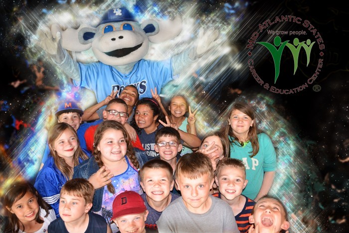 Group of kids with the Rocks baseball mascot